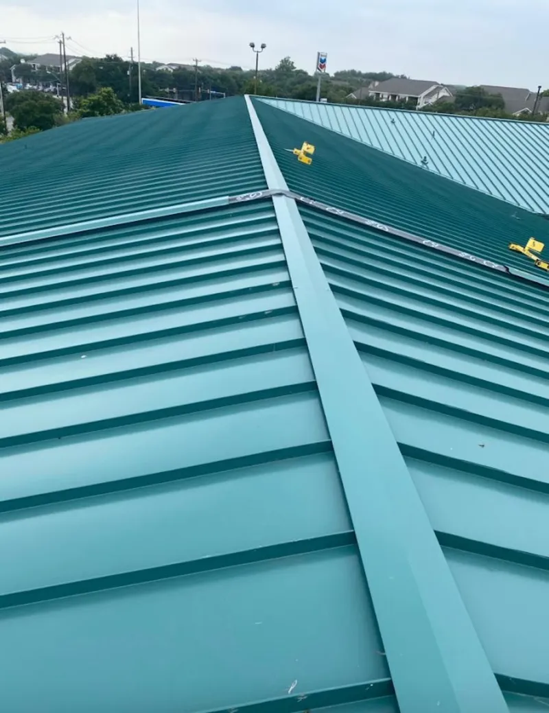 Green commercial metal roof ridge and valley for Metal Roof Repair in Montpelier